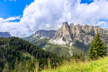 Mountain range of the Italian Dolomites surrounded by forest. Trentino-Alto Adige, Italy