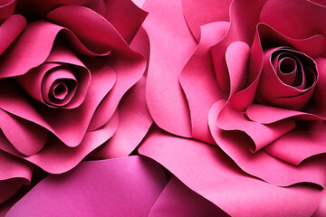 Beautiful flowers made of paper as background, top view
