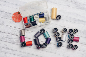 multicolored threads arranged in a certain order word love needlework needles pins
