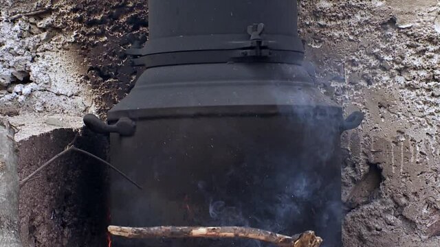 Karpathos Greece an old distillery on the fire where a farmer produces tsipouro raki and ouzo