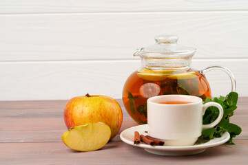 Apple tea drink served on wooden table