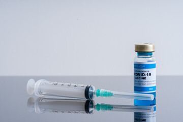 Medical concept ampoules or vials with Covid-19 vaccine on a laboratory bench