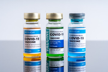 Medical concept ampoules or vials with Covid-19 vaccine on a laboratory bench