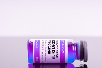 Medical concept ampoules or vials with Covid-19 vaccine on a laboratory bench
