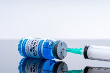 Medical concept ampoules or vials with Covid-19 vaccine on a laboratory bench