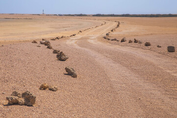 Improvised road, fenced by stones in Africa