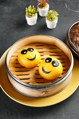 Closed bao bun with mango inside. Delicious chinese steamed sweet food. Chinese, asian, authentic food concept