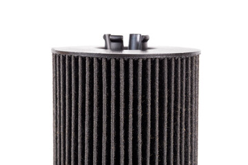 Car oil filter insert on white background, isolate. The concept of cleaning oil from dirt and impurities. Close-up