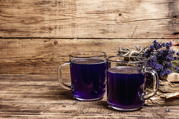Lavender hot tea on vintage wooden table