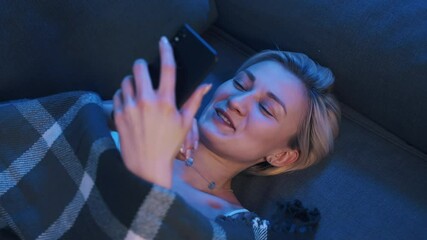 Happy young caucasian woman using a dating app or browsing social media