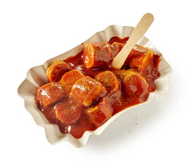 Delicious fast food dish of sausage slices and curry ketchup