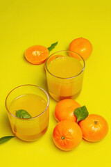 Sweet fruit jelly from fresh oranges and tangerines on summer yellow background