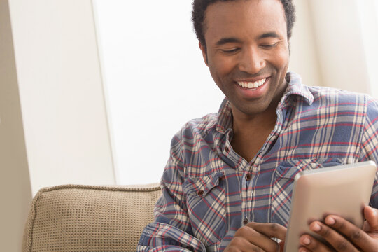 Young man with electronic book
