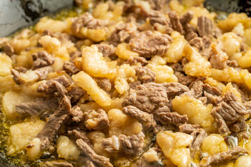 Fresh beef and suet being fried