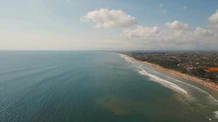 Aerial view beautiful beach, hotels and tourists, Bali, Kuta. Beautiful view nice tropical beach from the air. Seascape, beach, ocean, sky sea , Travel concept