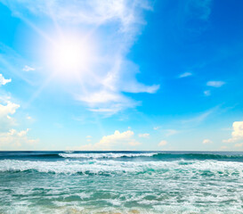 Beautiful seascape and sun on blue sky background.