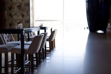 Interior of a cozy cafe with light from the window copy space.
