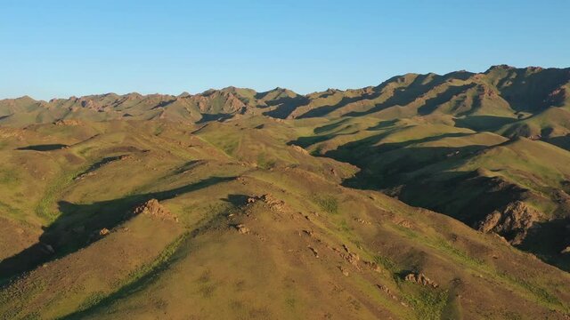 Aerial view of mountains landscape in Yol Valley at sunset, Mongolia, 4k