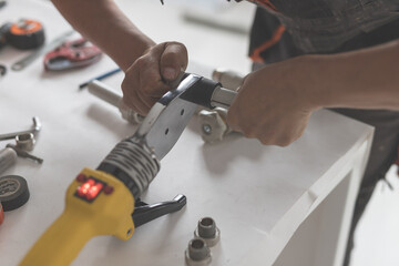 Man keep soldering iron for polypropylene