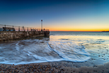 Sunrise over the beach at Swanage