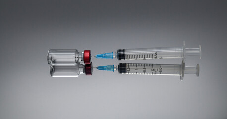 Vaccine and syringe.
Medicine, science and healthcare concept.