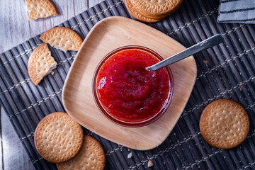 Top view of fresh Maria cookies (galletas Maria) and strawberry jam