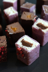 Dessert in a cut on a black background. Vegetarian glazed cheese, dessert for vegan children. Sugar free concept.