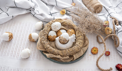 Fototapeta na wymiar Easter composition with festive eggs in a decorative nest.