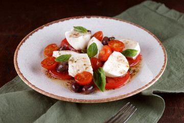 Salad with mozzarella, tomatoes and olives