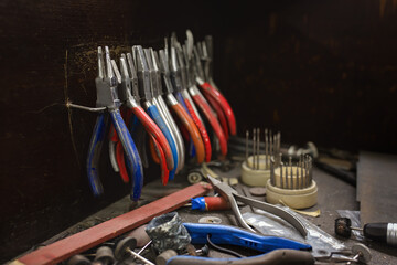 Fototapeta premium Goldsmith's bending pliers and other tools in the workshop.