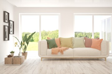 White living room with sofa and summer landscape in window. Scandinavian interior design. 3D illustration