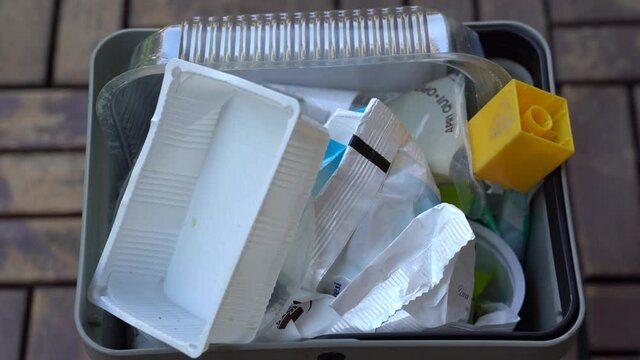 basket for the separate collection of plastic at home - waste from plastic food containers  thrown into the trash