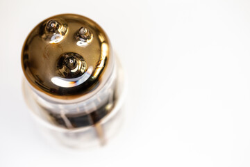 Large power electron tube for HiFi audio amplifier. Artificial light from above, top shot of the subject