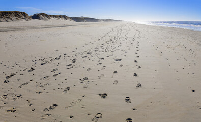 Footprints on a sandy beach near Esbjerg, Denmark.