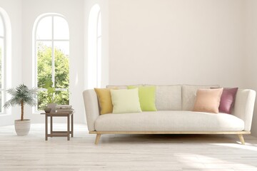 White living room with sofa and summer landscape in window. Scandinavian interior design. 3D illustration