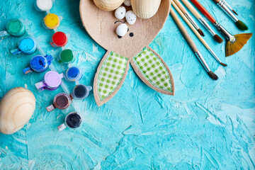 Top view pack of eggs with brush, paint and decorative elements