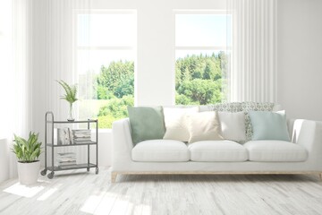 White living room with sofa and summer landscape in window. Scandinavian interior design. 3D illustration