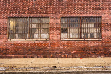 Vintage red brick industrial building with frosted windows in urban Chicago