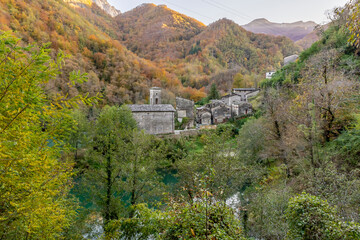 The ancient village of Isola Santa on the homonymous lake, surrounded by the mountains of Garfagnana, Italy