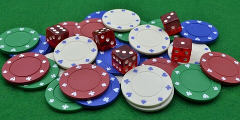 Set of Colorful Poker Chips and Red Dice on a Poker Table