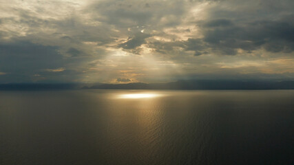 Obraz premium Colorful bright clouds during sunset over the sea, aerial view. Sunset over ocean. Seascape, Summer and travel vacation concept, Moalboal, Philippines.