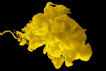 acrylic ink in water form an abstract smoke pattern isolated on black background