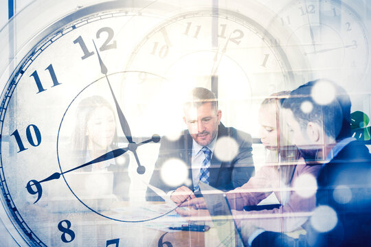 Business people doing meeting with clock background - Powered by Adobe