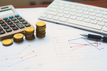 financial accounting analytics document report paperwork progress growth graph with money and chart on table with pen keyboard and calculator work for business planning.