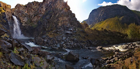 Russia. Russia. The South Of Western Siberia, the Altai Mountains. Kurkure waterfall in the valley of the Chulyshman River (the height of the free fall of water is 15 m).