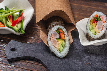 Still life. Japanese cuisine- roll in a package