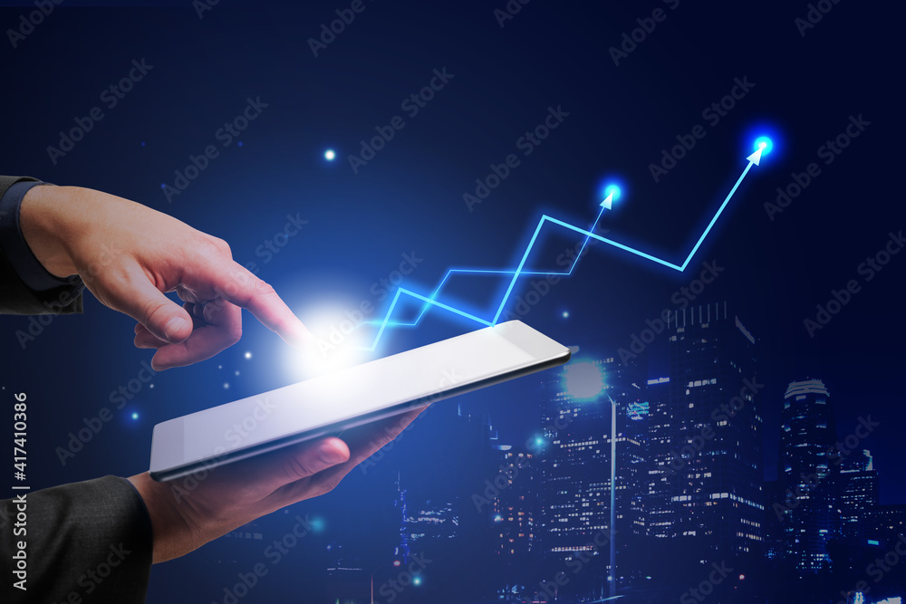 Aufkleber make profitable business concept with man hand touching digital tablet screen and glowing light bulb