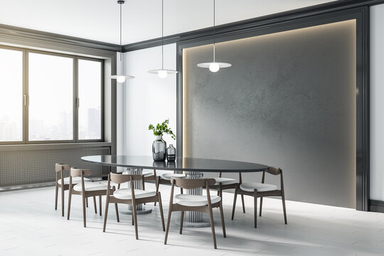 Stylish dining room with black backlit wall panel and black table with wooden chairs around