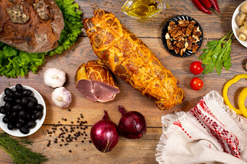 Assortment of cold cuts, a variety of processed cold meat products. On a wooden background