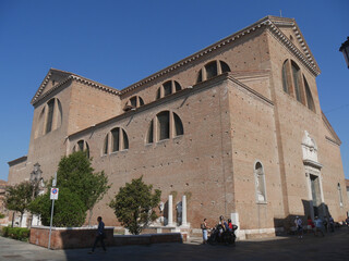 Chioggia, Cathedral of Santa Maria facade inspired by Palladian and right side with four columns of the ancient Cathedral